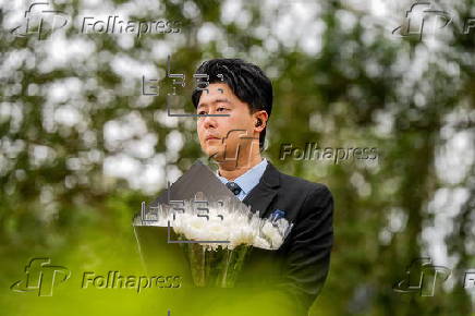 Roadside memorial for victims of the high-rise apartment fire in Hong Kong