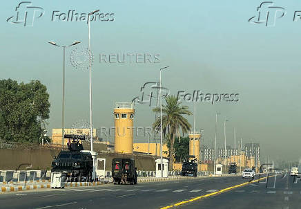 Armored vehicles belonging to Iraqi security forces are stationed outside the U.S. Embassy in Baghdad?s Green Zone,