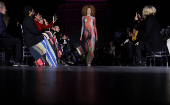 Models present creations by Alessa at the Christ the Redeemer statue to mark the launch of Rio Fashion Show, in Rio de Janeiro