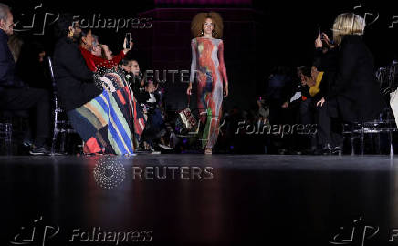 Models present creations by Alessa at the Christ the Redeemer statue to mark the launch of Rio Fashion Show, in Rio de Janeiro