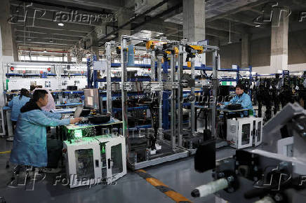 FILE PHOTO: Humanoid robots production at AgiBot factory in Shanghai