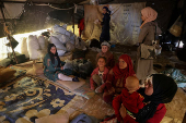 People gather on land between Deraa and Sweida