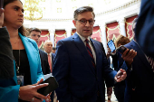 FILE PHOTO: FILE PHOTO: U.S. House Speaker Johnson speaks to reporters at the U.S. Capitol in Washington