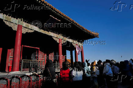 Tourists visit the Forbidden City in Beijing