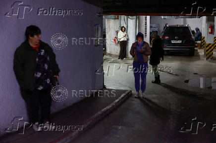 People take shelter during a Russian missile attack in Kyiv