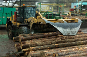 A loader transports logs into the sawmill at Gorman Bros. Lumber Ltd. in West Kelowna