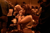 Worshippers participate in Stations of the Cross at St Mary’s Catholic Cathedral in Sydney