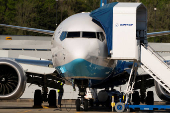 A Boeing jet intended for use by a Chinese airline returns to Boeing Field, in Seattle, Washington