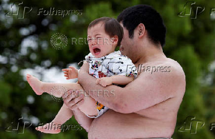 Babies take part in 'Nakizumo' or baby crying sumo contest at Senso-ji temple in Tokyo