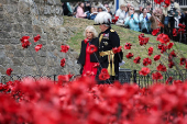 Britain's Queen Camilla views an installation of 30,000 ceramic poppies commemorating the 80th anniversary of Victory in Europe (VE) Day in London