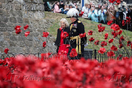 Britain's Queen Camilla views an installation of 30,000 ceramic poppies commemorating the 80th anniversary of Victory in Europe (VE) Day in London