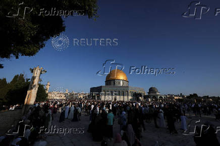 Palestinians pray on the first day of the Muslim holiday of Eid al-Adha, in Jerusalem's Old City