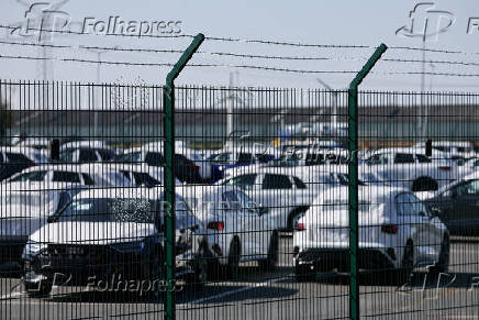 FILE PHOTO: Cars of the Volkswagen Group are waiting to be exported to the US from the seaport of Emden