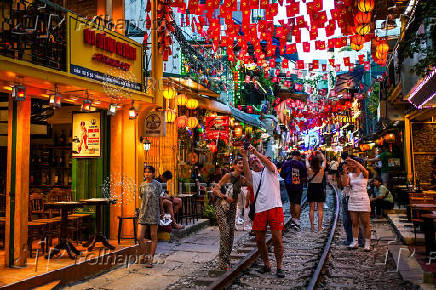 Tourists visit Hanoi Train Street, one of the famous tourist destinations in Hanoi