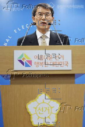 Rho Tae-ak, head of the National Election Commission, speaks during a press conference