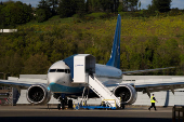 A Boeing jet intended for use by a Chinese airline returns to Boeing Field, in Seattle, Washington
