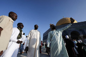 Palestinians pray on the first day of the Muslim holiday of Eid al-Adha, in Jerusalem's Old City