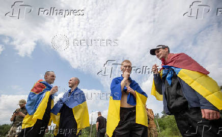 Ukrainian POWs are seen after a swap at an unknown location in Ukraine