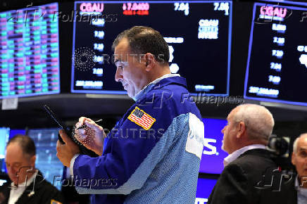 Traders work on the floor of the NYSE in New York