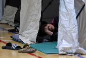 People evacuated from villages, damaged by torrential rain, rest at a temporary shelter, in Yesan,