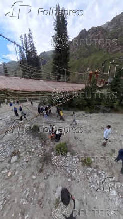 Aftermath of a suspension bridge collapse in Yili, Xinjiang Uyghur Autonomous Region