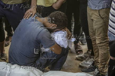 Palestinians mourn family killed in Israeli airstrike on Gaza refugee camp