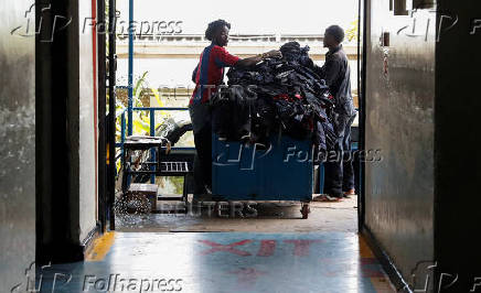 Kenyan workers prepare clothes for export at the United Aryan EPZ factory in Ruaraka district of Nairobi