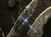 A drone view shows Israeli protesters display lights in the waters of the Mediterranean, in the shape of a ribbon symbolising support for hostages kidnapped from Israel by Hamas, in Tel Aviv