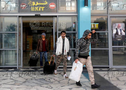 FILE PHOTO: Afghans, whose asylum applications have been rejected, arrive from Germany in Kabul airport