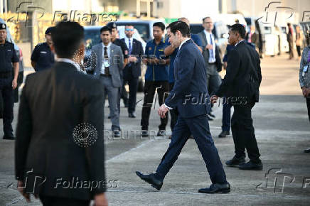 U.S. Secretary of State Marco Rubio walks on the tarmac upon arriving at Subang Air Base