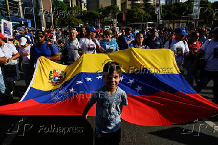Demonstrators march to demand the return of Venezuelan migrant children after their parents were deported from the U.S., in Caracas