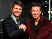 FILE PHOTO: U.S. actor Tom Cruise poses with Austrian skydiver Felix Baumgartner on the red carpet for the German language premiere of Cruise's film 