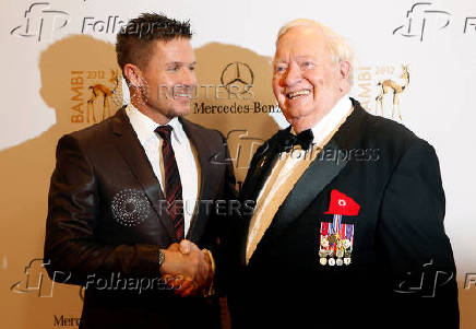 FILE PHOTO: Austrian space skydiver Baumgartner and U.S. pilot Joseph William Kittinger arrive for Bambi Awards 2012 in Duesseldorf