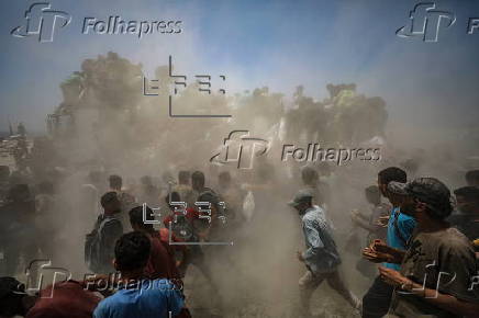 Aid enters Gaza Strip after Israel announces daily pause of hostilities