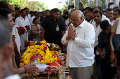 Gujarat Chief Minister Bhupendra Patel pays his respects to the body of Yatish Parmar, who was killed in a suspected militant attack near scenic Pahalgam in south Kashmir, after Patel's body was brought to his home in Bhavnagar,