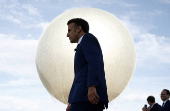 French President Macron visits reinstallation site of Olympic cauldron in Paris