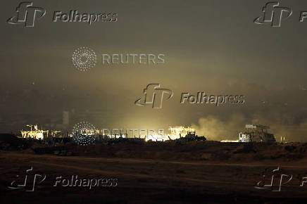 Smoke and flames rise following an explosion in Gaza, as seen from Israel