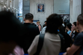 A migrant is detained by federal immigration officers at U.S. immigration court