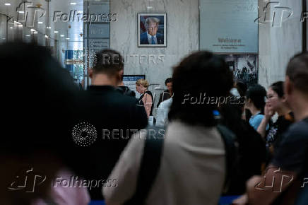 A migrant is detained by federal immigration officers at U.S. immigration court