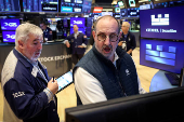 Traders work on the floor of the NYSE in New York