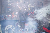 Players of Bologna FC and fans celebrate in Bologna