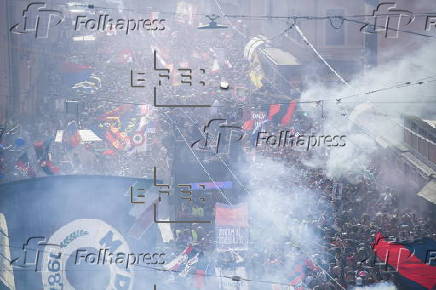 Players of Bologna FC and fans celebrate in Bologna