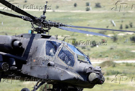 A Greek Apache helicopter flies as NATO holds training exercise 'Immediate Response' drills with host nations Albania, Bulgaria, Croatia, Greece, Kosovo, Montenegro, and North Macedonia, at Krivolak army base