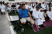 Palestinians from Gaza attend Eid al-Adha prayers, at Al Thumama Complex,  in Doha