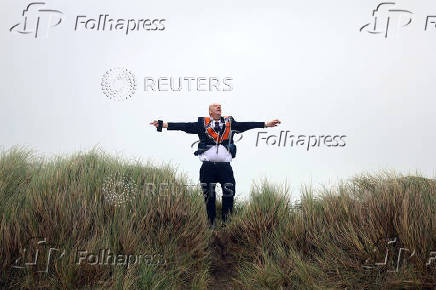 Member of the Orange Order reacts following a march along the beach in Rossnowlagh in County Donegal