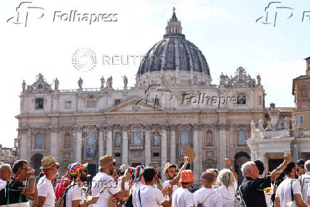 LGBTQ Pilgrims walk toward St. Peter's Basilica