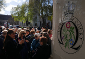 People await a ruling on an appeal by For Women Scotland outside the Supreme Court in London