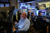 Traders work on the floor at the New York Stock Exchange (NYSE) in New York City