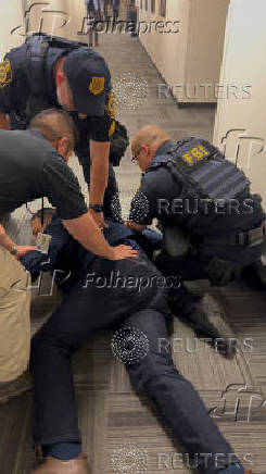 U.S. Senator Padilla is handcuffed by security during U.S. Homeland Security Secretary Noem's press conference, in Los Angeles
