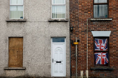 FILE PHOTO: A house displays a Union Jack flag in its window, in Ballymena